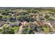 Aesthetic aerial view of a landscaped property, with a blue outline and a beautiful surrounding neighborhood at 14624 Pine Lake St, Clermont, FL 34711