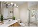 Well-lit bathroom with modern lighting and a glass-enclosed shower at 14624 Pine Lake St, Clermont, FL 34711