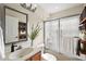 Updated bathroom with a sliding glass shower door and modern fixtures at 14624 Pine Lake St, Clermont, FL 34711