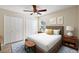 Comfortable bedroom with a ceiling fan, ample closet space, and natural light at 14624 Pine Lake St, Clermont, FL 34711