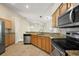 Bright kitchen featuring stainless steel appliances, granite countertops and an open layout at 14624 Pine Lake St, Clermont, FL 34711
