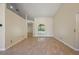 Bright living room with tile floors, neutral walls, and arched windows with views of the front yard at 14624 Pine Lake St, Clermont, FL 34711