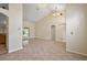 Open layout with tile flooring, neutral paint, recessed lighting and an arched doorway at 14624 Pine Lake St, Clermont, FL 34711