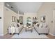 Bright living room featuring neutral tones, modern furnishings, and a large arched window at 14624 Pine Lake St, Clermont, FL 34711