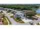 Aerial shot showcasing a house with a pristine yard, long driveway, and palm tree accents at 16608 W Citrus Pkwy, Clermont, FL 34714