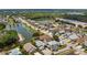 Scenic aerial view of a neighborhood with homes, serene lakes, and lush greenery at 16608 W Citrus Pkwy, Clermont, FL 34714