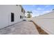 A large paved backyard area with white fencing, providing an open space for outdoor activities at 16608 W Citrus Pkwy, Clermont, FL 34714