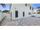 Spacious backyard with paved patio and white fence offering privacy and a clean aesthetic at 16608 W Citrus Pkwy, Clermont, FL 34714