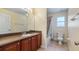 Bathroom showcasing vanity with sink, a toilet, and shower with curtain at 16608 W Citrus Pkwy, Clermont, FL 34714