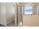 Bathroom view of glass enclosed shower with tiled walls and flooring at 16608 W Citrus Pkwy, Clermont, FL 34714