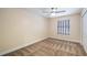 Bedroom view of large closet, neutral walls, carpet, and a window with blinds at 16608 W Citrus Pkwy, Clermont, FL 34714