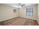 Bedroom with neutral walls, carpet, and a view of the backyard at 16608 W Citrus Pkwy, Clermont, FL 34714