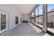 Attached carport featuring a concrete floor, a wall of windows, and ample space for gatherings at 16608 W Citrus Pkwy, Clermont, FL 34714