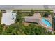 Bird's eye view of a community pool area with ample parking and shaded seating at 16608 W Citrus Pkwy, Clermont, FL 34714