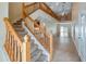 Elegant entryway featuring a staircase, tile flooring, and an open view to the living area at 16608 W Citrus Pkwy, Clermont, FL 34714