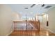 Upstairs hallway with hardwood floors and natural light at 16608 W Citrus Pkwy, Clermont, FL 34714