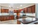 Stylish kitchen with stainless steel appliances, wood cabinets, and a functional design for cooking at 16608 W Citrus Pkwy, Clermont, FL 34714