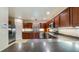 Well-equipped kitchen with stainless steel appliances, wood cabinetry, and ample counter space at 16608 W Citrus Pkwy, Clermont, FL 34714