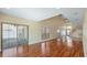 Bright and spacious living room with tall ceilings, hardwood floors, and lots of natural light at 16608 W Citrus Pkwy, Clermont, FL 34714