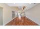 Bright and spacious living room with tall ceilings, hardwood floors, and lots of natural light at 16608 W Citrus Pkwy, Clermont, FL 34714