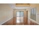 Bright and airy living room with hardwood floors and sliding glass doors at 16608 W Citrus Pkwy, Clermont, FL 34714