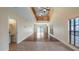 Bright and spacious living room with tall ceilings, hardwood floors, and lots of natural light at 16608 W Citrus Pkwy, Clermont, FL 34714