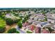 Beautiful aerial shot showcasing a residential area with lush greenery and well-spaced homes at 17174 Se 76Th Caledonia Ter, The Villages, FL 32162