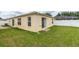 Well-maintained backyard featuring green lawn, offering a tranquil outdoor setting at 17174 Se 76Th Caledonia Ter, The Villages, FL 32162