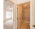 Bathroom featuring a shower-tub combination adjacent to a bedroom with a ceiling fan at 17174 Se 76Th Caledonia Ter, The Villages, FL 32162