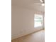 Bright bedroom with a large window offering a view of the surrounding neighborhood at 17174 Se 76Th Caledonia Ter, The Villages, FL 32162