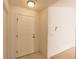 Neutral colored entryway highlighting the front door with carpet and tile at 17174 Se 76Th Caledonia Ter, The Villages, FL 32162
