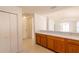 View of kitchen counter with wooden cabinets, and an entry hallway to the front door at 17174 Se 76Th Caledonia Ter, The Villages, FL 32162