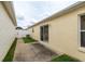 Back patio with room for seating, offers a space for outdoor relaxation and dining at 17174 Se 76Th Caledonia Ter, The Villages, FL 32162