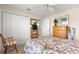 Inviting bedroom with a bed and dresser, providing ample space for relaxation and personal storage at 1723 Townsend Ter, The Villages, FL 32162