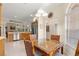 Sunny breakfast nook with a dining table, many windows, and an open view to the kitchen at 1723 Townsend Ter, The Villages, FL 32162