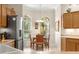 Sunny breakfast nook featuring light wood cabinetry, stainless appliances, and a bright window at 1723 Townsend Ter, The Villages, FL 32162