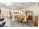 Open concept home with dining room, view of the kitchen, living room, and entryway at 1723 Townsend Ter, The Villages, FL 32162