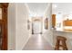 Bright entryway featuring tile floors, neutral paint, and a glimpse into other living areas at 1723 Townsend Ter, The Villages, FL 32162