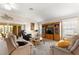 Spacious living room with neutral walls, carpeted floors, lots of natural light and comfortable seating at 1723 Townsend Ter, The Villages, FL 32162