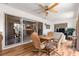 Sunroom with tile floors and wicker furniture, sliding glass doors lead to other rooms and outdoor spaces at 1723 Townsend Ter, The Villages, FL 32162