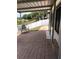 Covered patio features brick pavers, open views of the surrounding landscape, and a seating area at 1730 Ridgemoor Dr, Mascotte, FL 34753