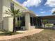 Beautiful home exterior showcasing a lovely walkway, lush landscaping, and a convenient covered parking area at 1730 Ridgemoor Dr, Mascotte, FL 34753