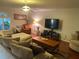Comfortable living room with a ceiling fan, recessed lighting, hardwood floors, and cozy seating arrangement at 1730 Ridgemoor Dr, Mascotte, FL 34753
