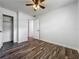 Bright bedroom offers great natural light, wood-look floors, and ample closet space at 1905 Selleen Dr, Eustis, FL 32726
