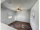 Dining room with updated flooring, natural light, and a ceiling fan for added comfort at 1905 Selleen Dr, Eustis, FL 32726