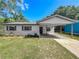Charming single-story home with a carport, complemented by fresh landscaping and a well-maintained lawn at 1905 Selleen Dr, Eustis, FL 32726