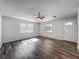 Bright and airy living room features hardwood flooring and lots of natural light at 1905 Selleen Dr, Eustis, FL 32726