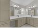 Bright bathroom with double sinks and white cabinets at 2124 Hames Ln, The Villages, FL 32162