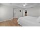 Bedroom with ensuite bathroom and wood look floors at 2124 Hames Ln, The Villages, FL 32162