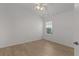 Neutral bedroom with wood-look flooring and a ceiling fan at 2124 Hames Ln, The Villages, FL 32162